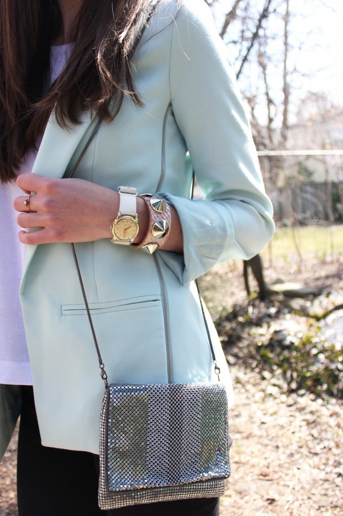 Style Bee in a blue blazer, black pants and silver purse