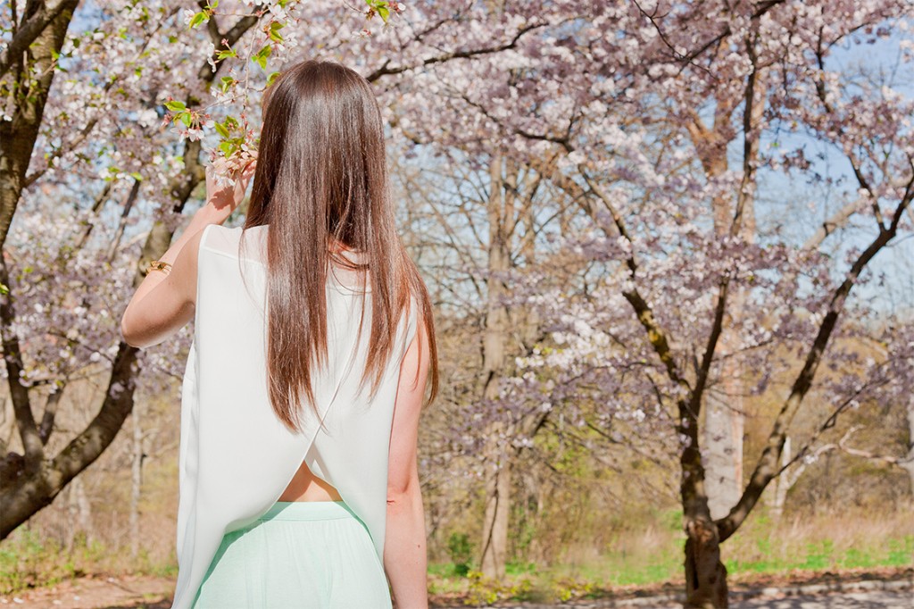 Style Bee in a white top and mint skirt