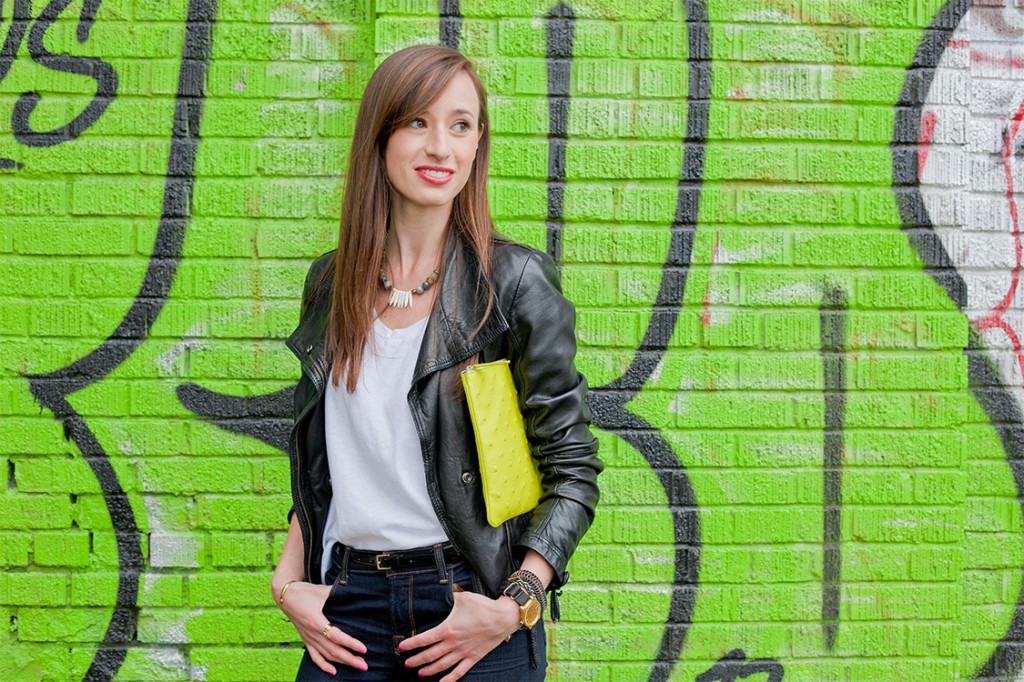 Style Bee in jeans, a white tee and lime green clutch.