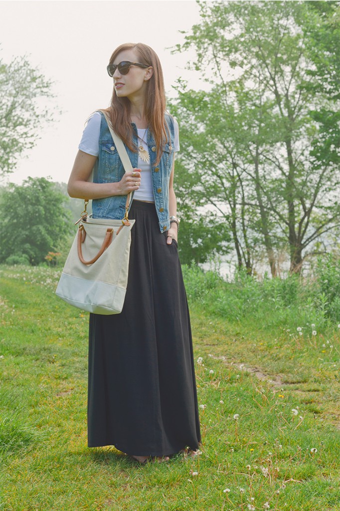 Style Bee in black maxi skirt, White crop tee, denim vest, with canvas tote