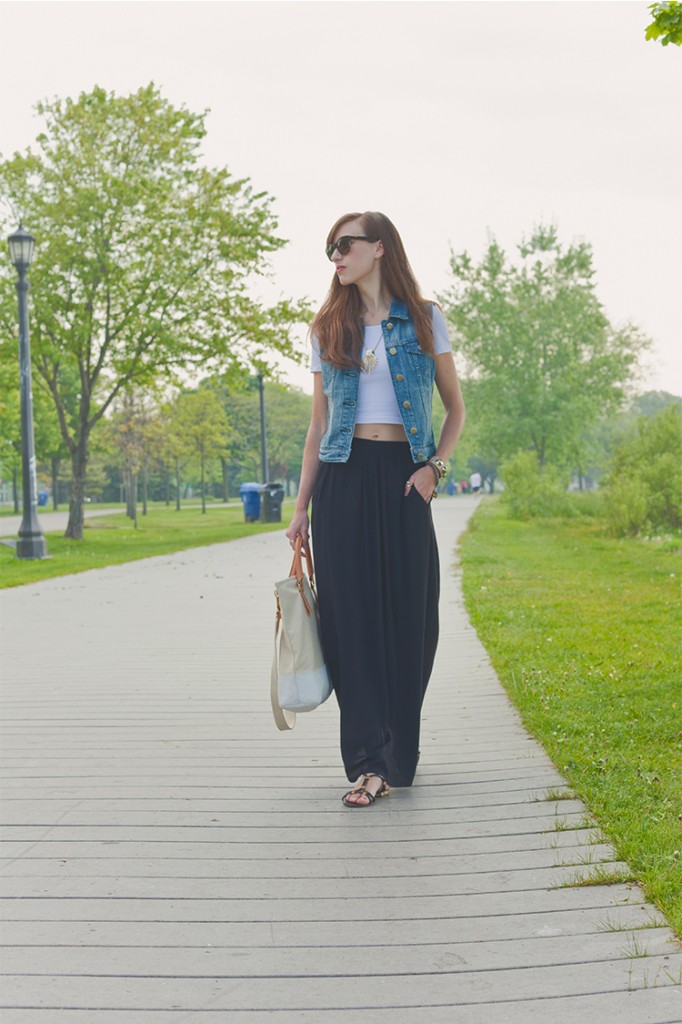 Style Bee in black maxi skirt, White crop tee, denim vest, with canvas tote