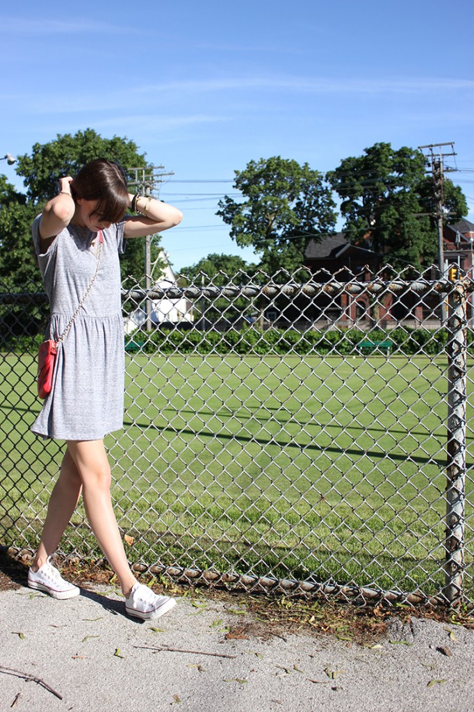 Style Bee in a grey dress, botkier bag and converse sneakers