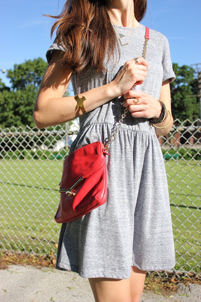 Style Bee in a grey dress, botkier bag.