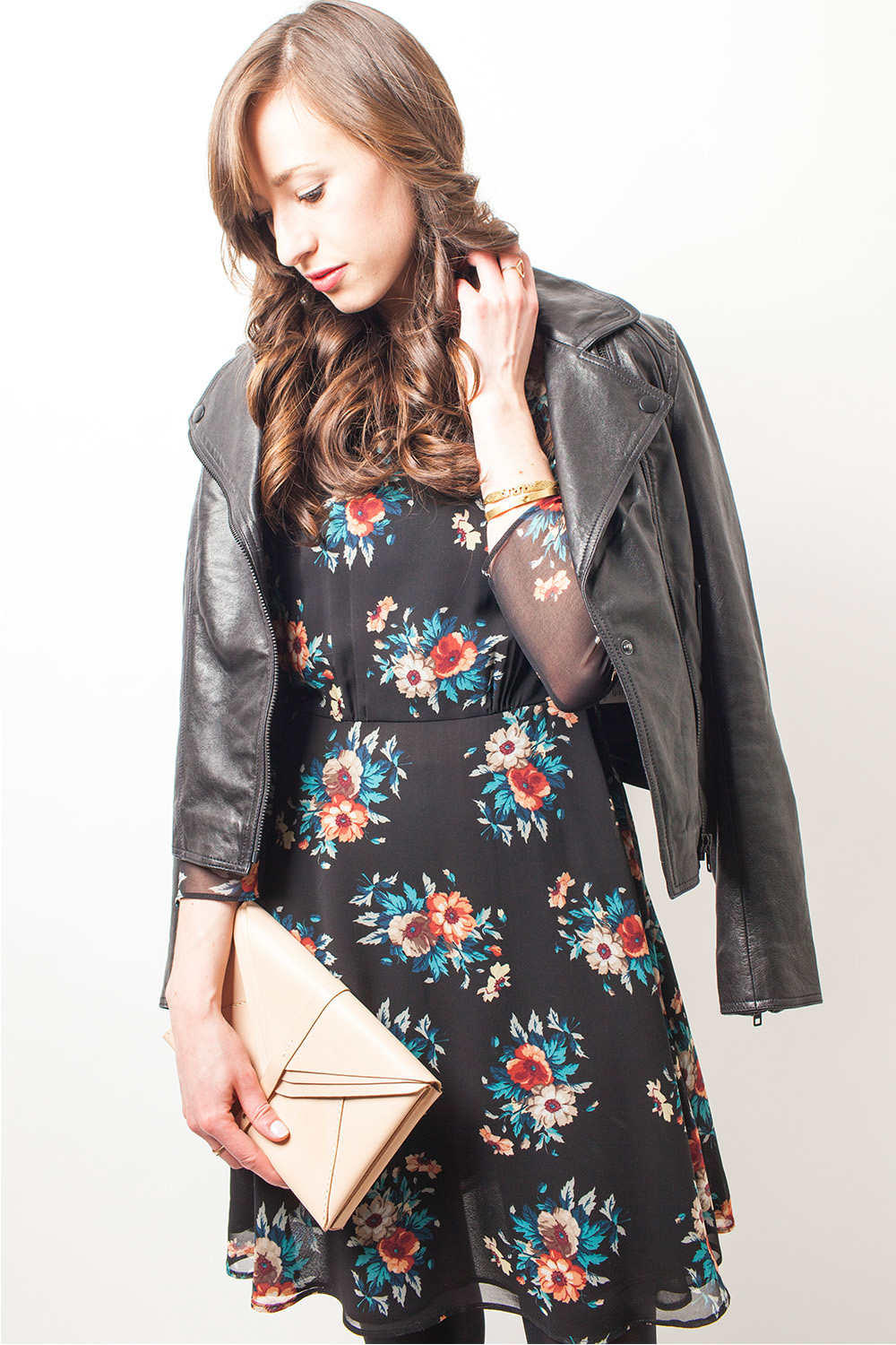 Style Bee in a Floral dress and leather jacket.