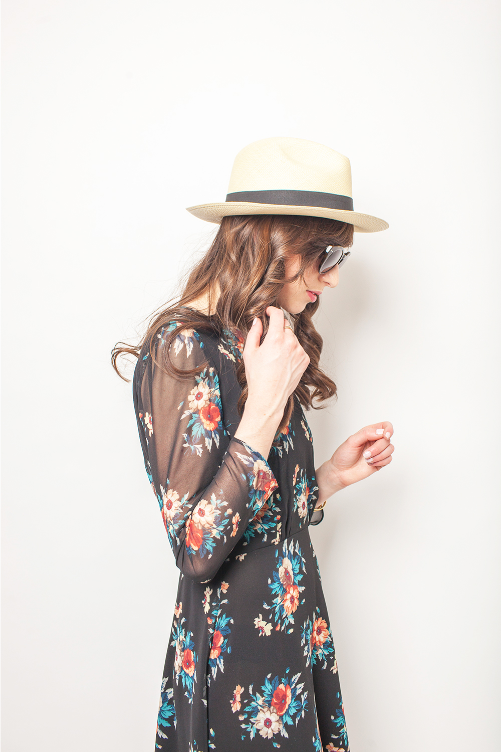 Style Bee in a floral dress and J.Crew hat.