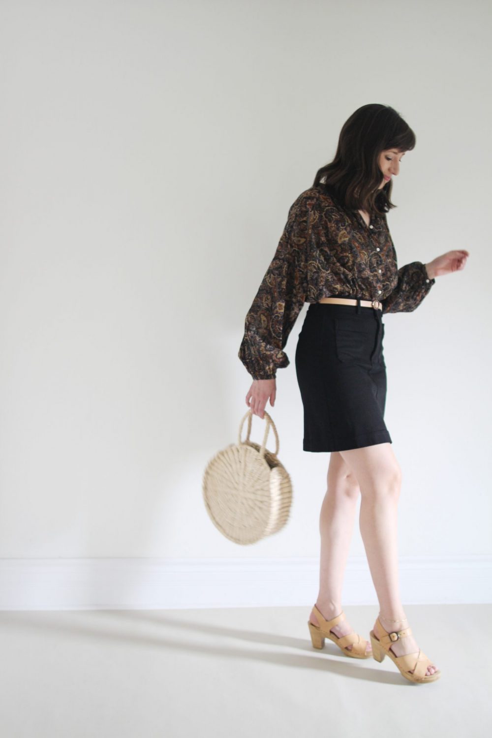 August Outfits - Look 2 - Paisley Blouse + Black Mini Skirt + Nude Belt + Clogs + Woven Circle Tote 